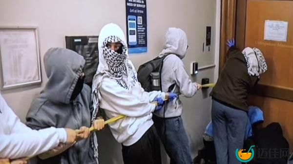 Anti-Israel supporters breaking into the Hamilton Hall building at Columbia University on April 30, 2024.