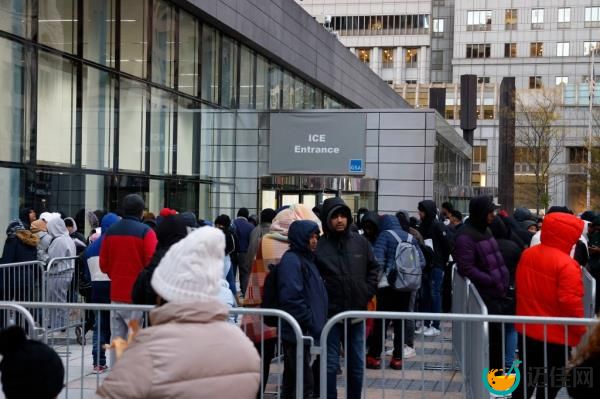 Hundreds of migrants from all over the world wait in line at 26 Federal Plaza in downtown Manhattan to enter the ICE office there.