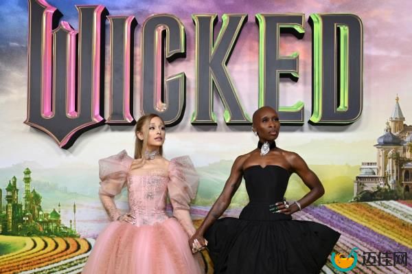 This image released by Universal Pictures shows Ariana Grande, as Glinda, left, and Cynthia Erivo, as Elphaba, in a scene from the film 
