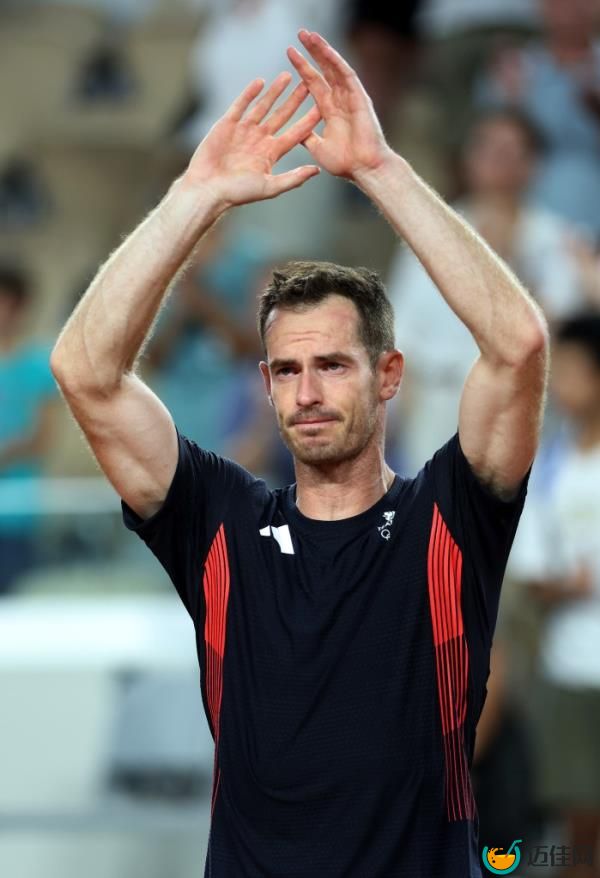 Andy Murray of Team Great Britain acknowledges the crowd with partner (not in f<em></em>rame) Daniel Evans of Team Great Britain after losing match point against Taylor Fritz of Team United States and Tommy Paul of Team United States during the Men