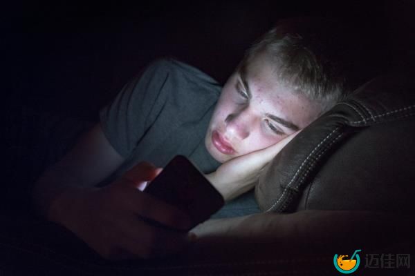 Depressed **** boy looking at phone