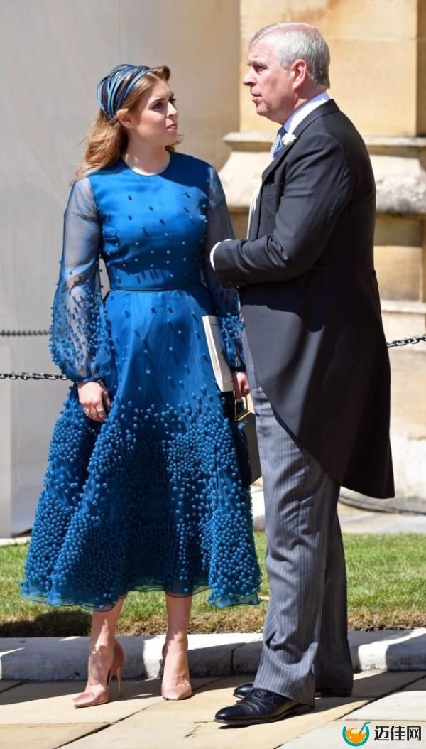Prince Andrew and Princess Beatrice in black attire observing the transfer of Queen Elizabeth II