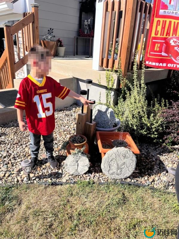 Child stands at memorial