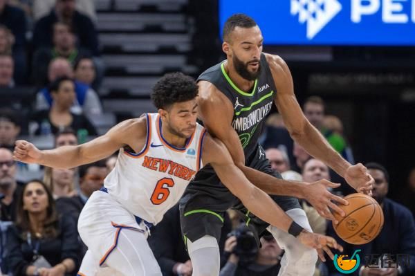 Quentin Grimes battles Rudy Gobert for a loose ball during the Knicks