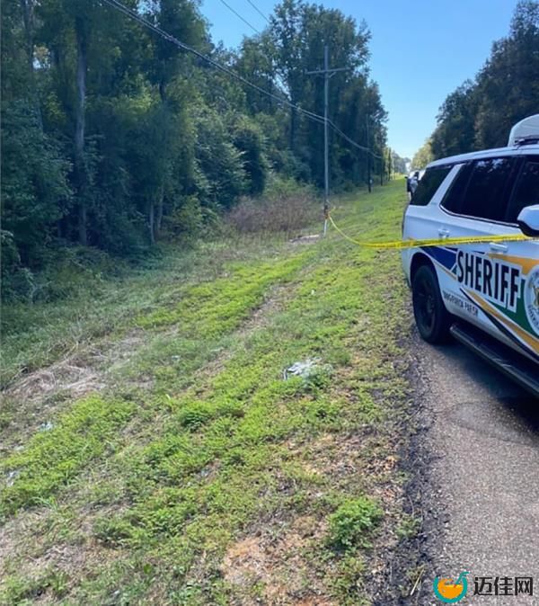 Police vehicle near the side of the road.