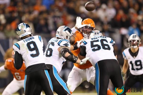 Bears defensive tackle Gervon Dexter Sr. is blocked by Panthers guard Calvin Throckmorton and center Bradley Bozeman on Nov. 9, 2023, at Soldier Field. 