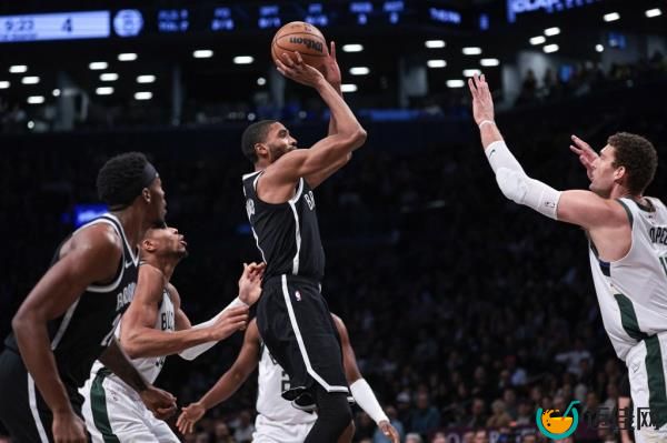 Mikal Bridges shoots against the Milwaukee Bucks. 
