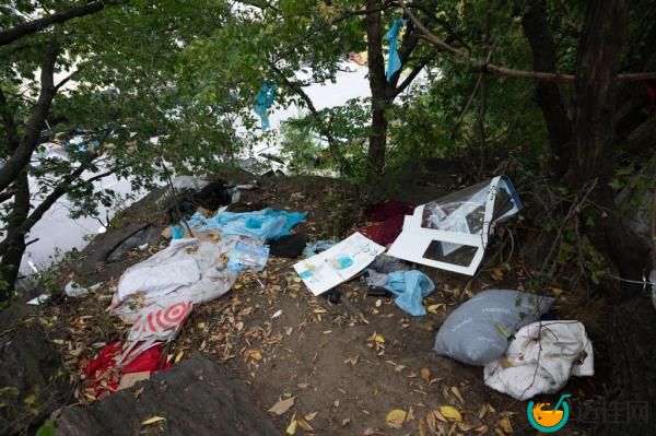 A photo showing remnants of an encampment on a ridge that overlooks the court