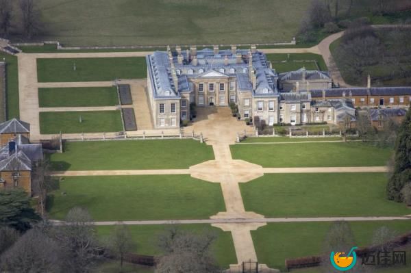 Aerial view of Althorp, the grade 1 listed stately home in Northamptonshire, England, known as the childhood home of Lady Diana Spencer, Princess of Wales, featuring a large lawn and path.