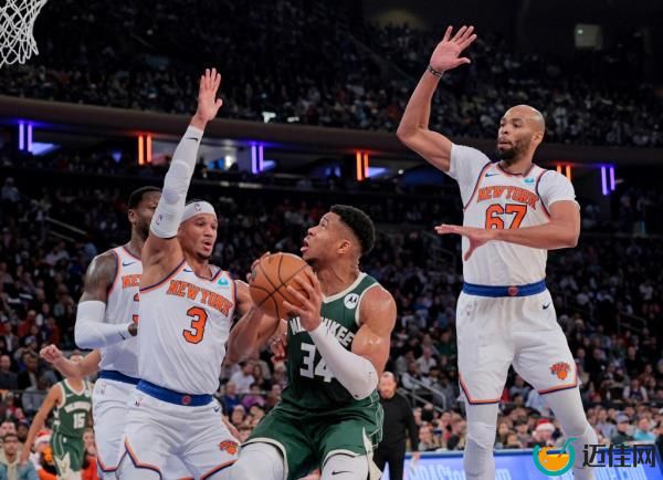 Knicks center Taj Gibson (67) tries to block a Giannis Antetokounmpo (34) shot on Dec. 25, 2023.