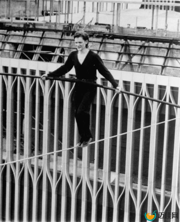 Petit balances as he crosses a cable stretched between the World Trade Center towers high above New York City.