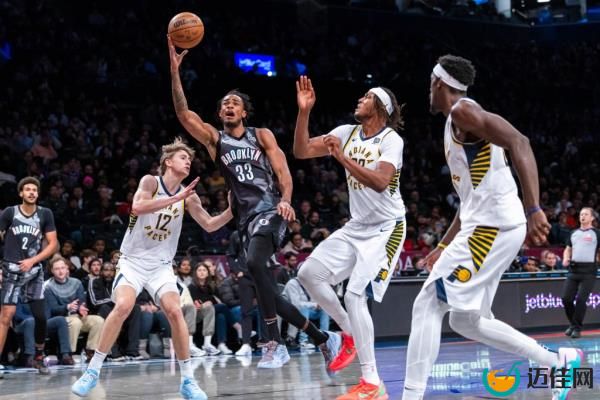 Nic Claxton #33 of the Brooklyn Nets goes up for a shot between Johnny Furphy #12 of the Indiana Pacers and Myles Turner #33 of the Indiana Pacers in the second half at Barclays Center. 