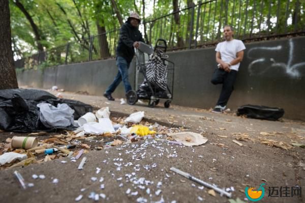 Drug paraphernalia, vials of blood and garbage are seen this week on Walton Avenue. 