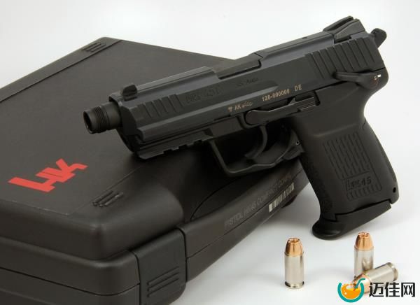 Heckler & Koch HK45, sitting on a case with three bullets nearby