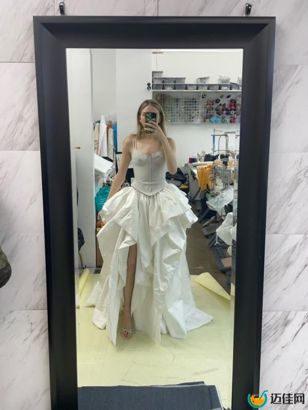 Seline Meisler, 30, trying on her dress during the dressmaking process. 