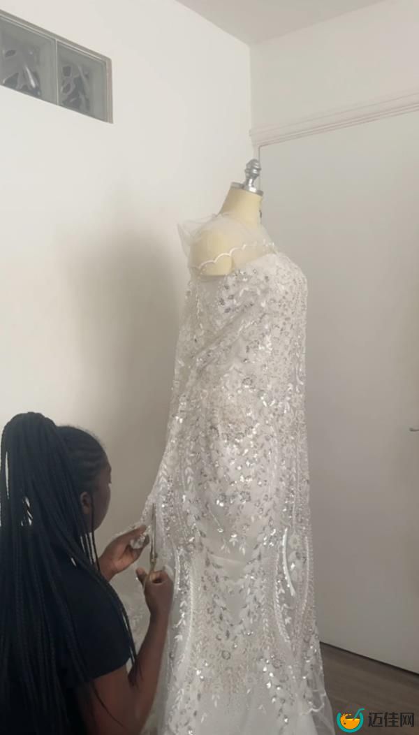 Amoako making her wedding dress. 