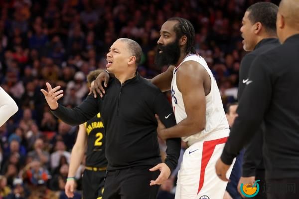 James Harden restraining Tyronn Lue, LA Clippers head coach, during Clippers vs. Golden State Warriors basketball game.