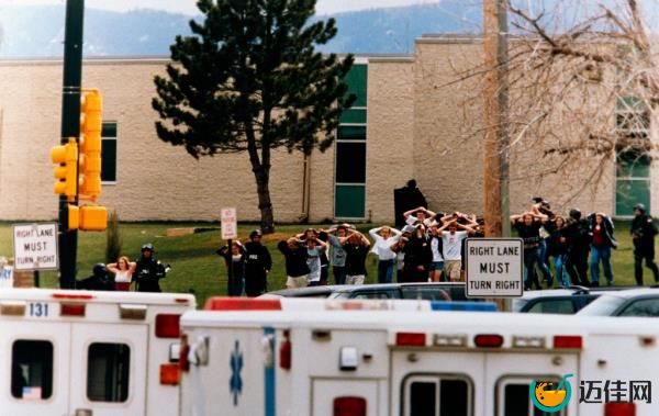 Students run out of the Columbine High School during the mass shooting on April 20, 1999.