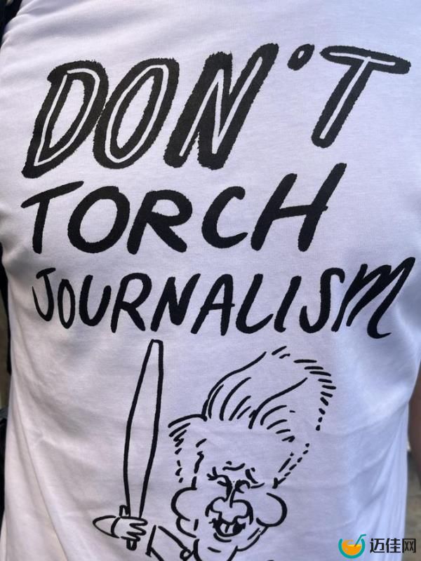 Staff members were found sporting T-shirts of Mr Sneesby holding the Olympic torch accompanied by the words “don’t torch journalism”. Picture: Supplied.
