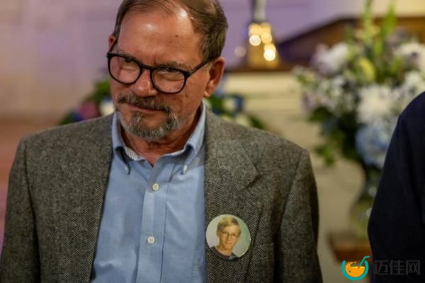 Tom Mauser, the father of Daniel Mauser, a sophomore who was killed in the mass shooting at Columbine High School, wears a button with his son