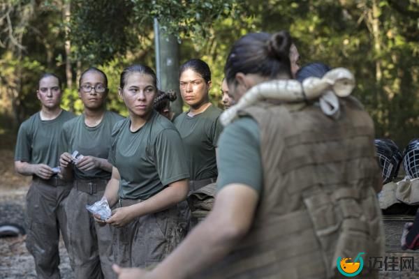Members of a platoon of female U.S. Marine Corps recruits gear up before training in hand-to-hand combat at the Marine Corps Recruit Depot, Thursday, June 29, 2023, in Parris Island, S.C.