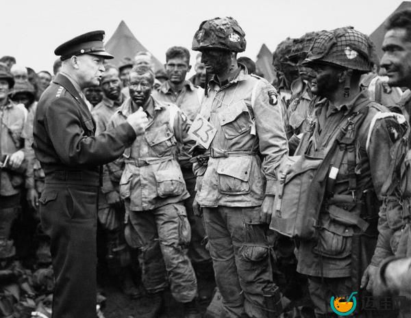 U.S. Gen. Dwight D. Eisenhower, left, gives the order of the day to paratroopers in England prior to boarding their planes to participate in the first assault of the Normandy invasion.